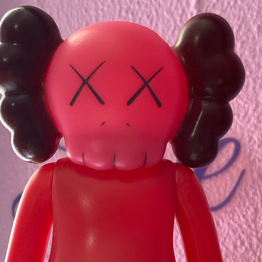 KAWS red vinyl figure